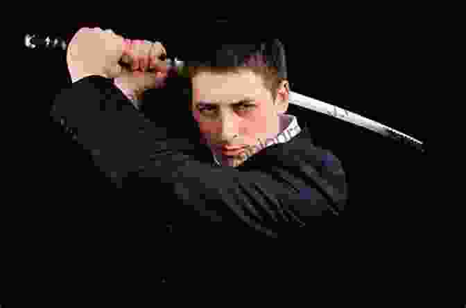 Harry Fox, A Young Man With A Determined Expression, Holding A Sword And Shield The Achilles Legend: Harry Fox 4